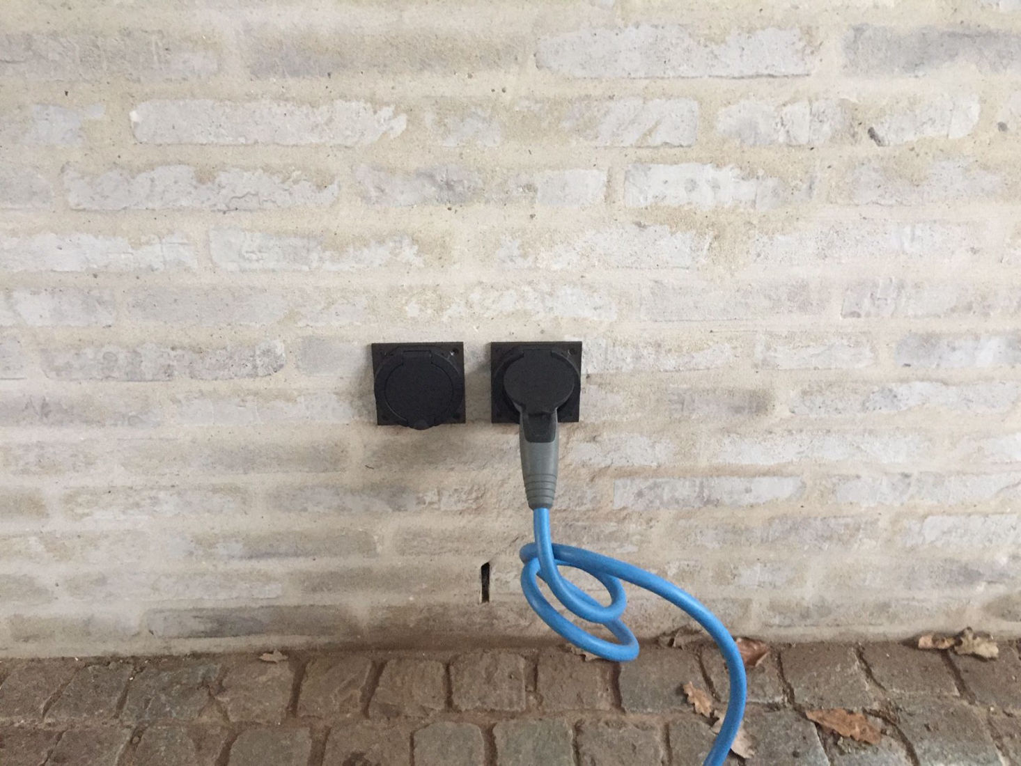 Extended EV outlet. The charger is hidden behind the wall. Only the sockets are visible